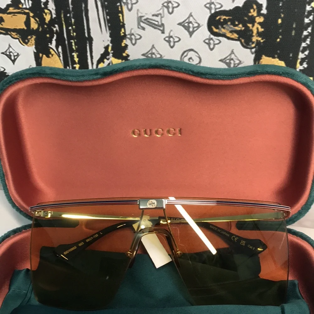 New Authentic GG1096S 003 Sunglasses by Gucci™ Shield, Material: Metal, Rimless.